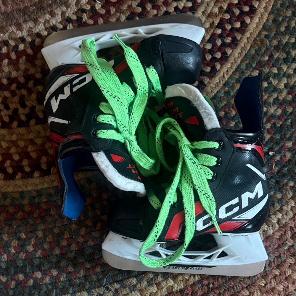 CCM Next Kids 11 Black Hockey Skates with Neon Green Laces and Red Accents
